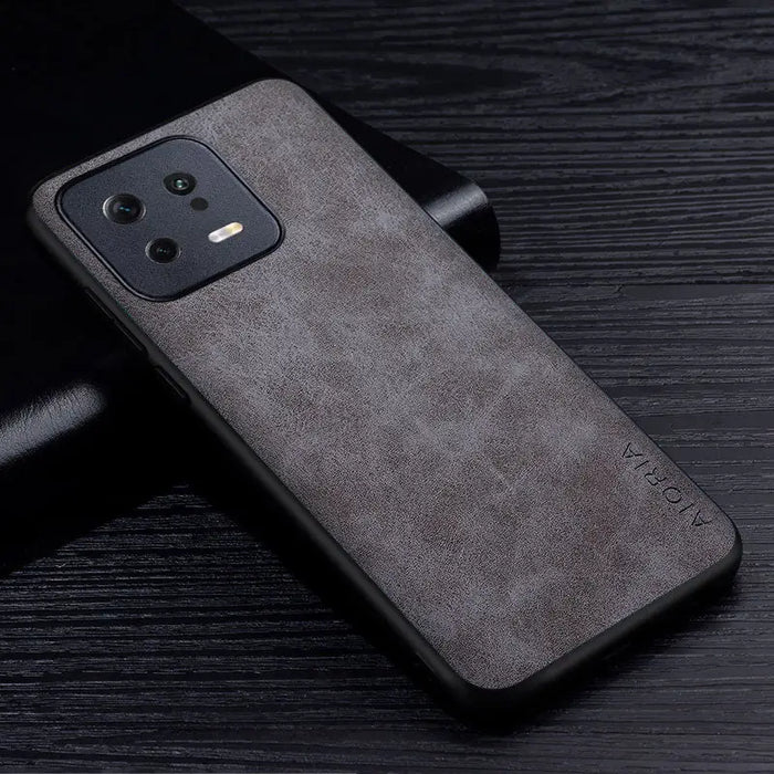the back of a black leather case with a black leather cover