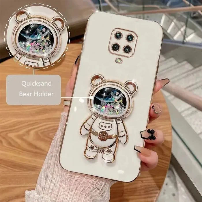a person holding a phone case with a bear design