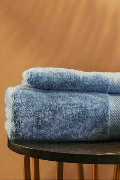 Sky-blue Pima cotton terry towel, folded close-up stack