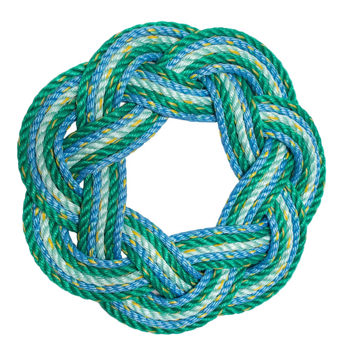 A Sailor's Wreath in varying shades of blue and green made from lobster rope