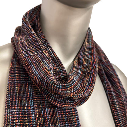 Multicolored scarf on a mannequin against a white background