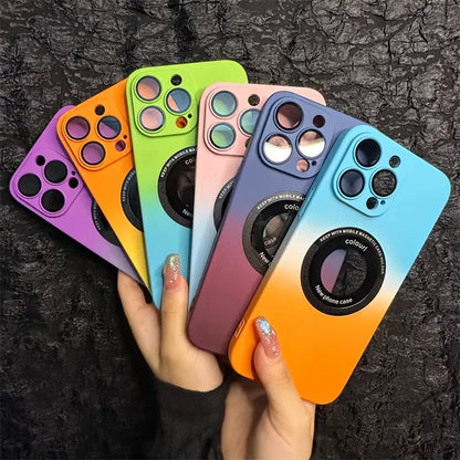 a hand holding four iphone cases