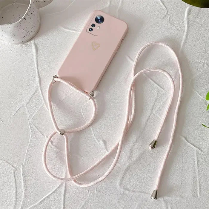 A pink phone case with a white strap