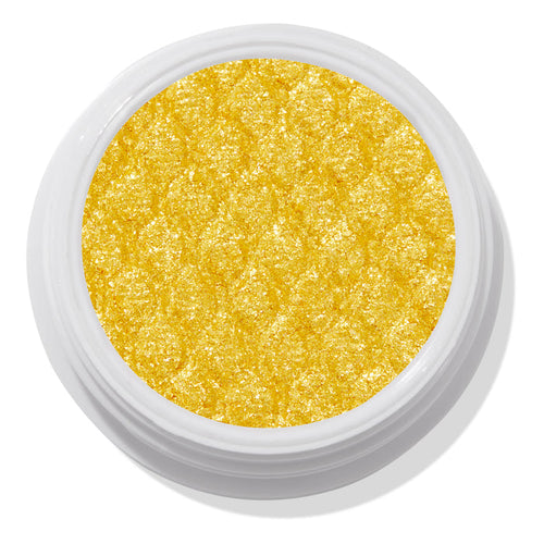 ColourPop Super Shock Shadow Tankini shows a vibrant metallic yellow‑gold pan sparkling with a quilted, bouncy texture, sitting open in a white jar against a clean white studio background.