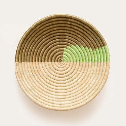 Woven basket with a gradient color design on a white background