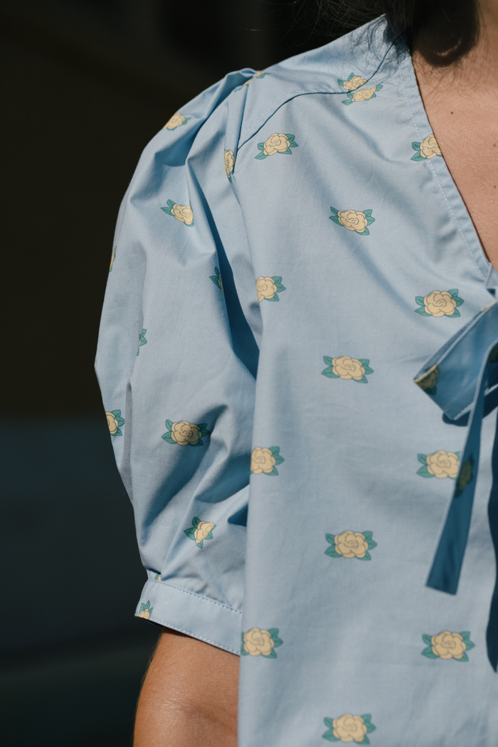 Tiny Big Sister floral bow blouse in soft cotton. Pretty, lightweight and perfect for everyday summer styling. Shop at Dotique.