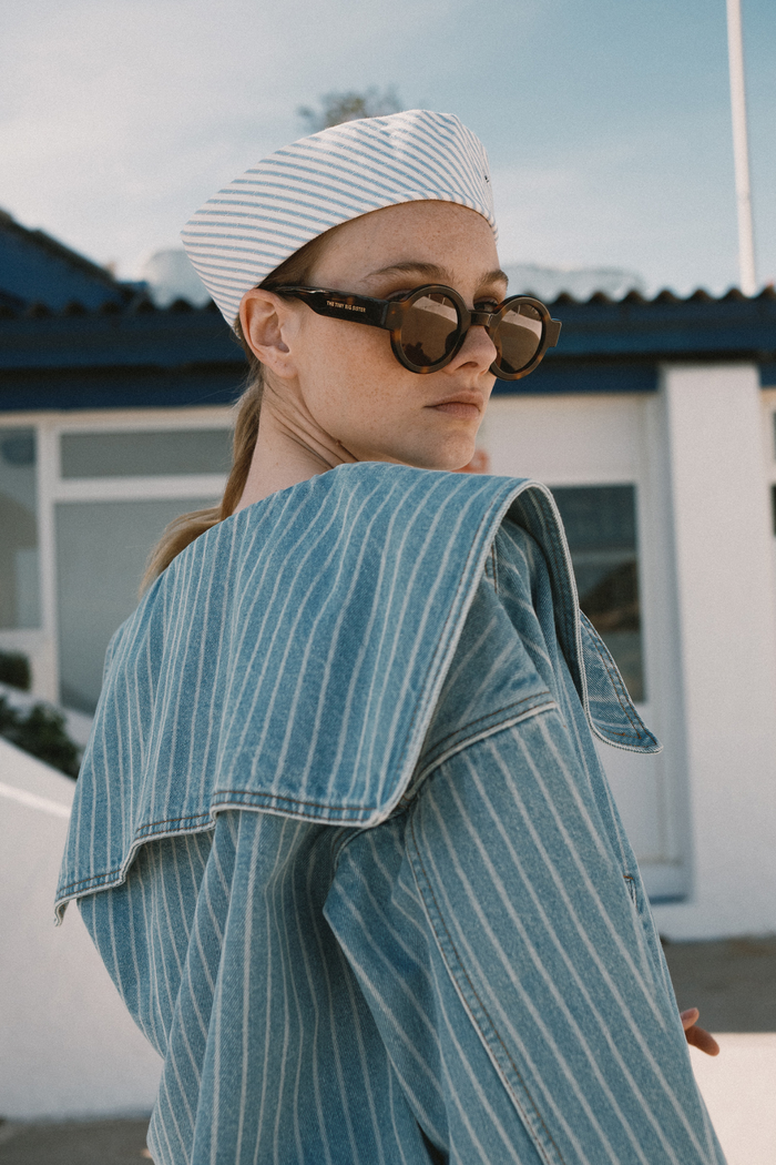Tiny Big Sister striped cotton jacket with collar and relaxed fit. A stylish, lightweight layer for spring and summer. Shop at Dotique.
