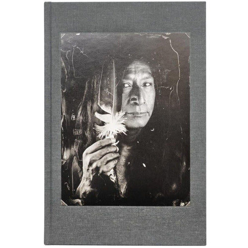 Book cover for 'Tomas van Houtryve: Lines and Lineage' with a black and white photograph of a Native American holding a feather