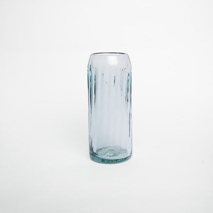 A clear glass with a solid pattern and no visible contents.