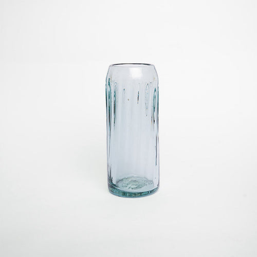 A clear glass with a solid pattern and no visible contents.