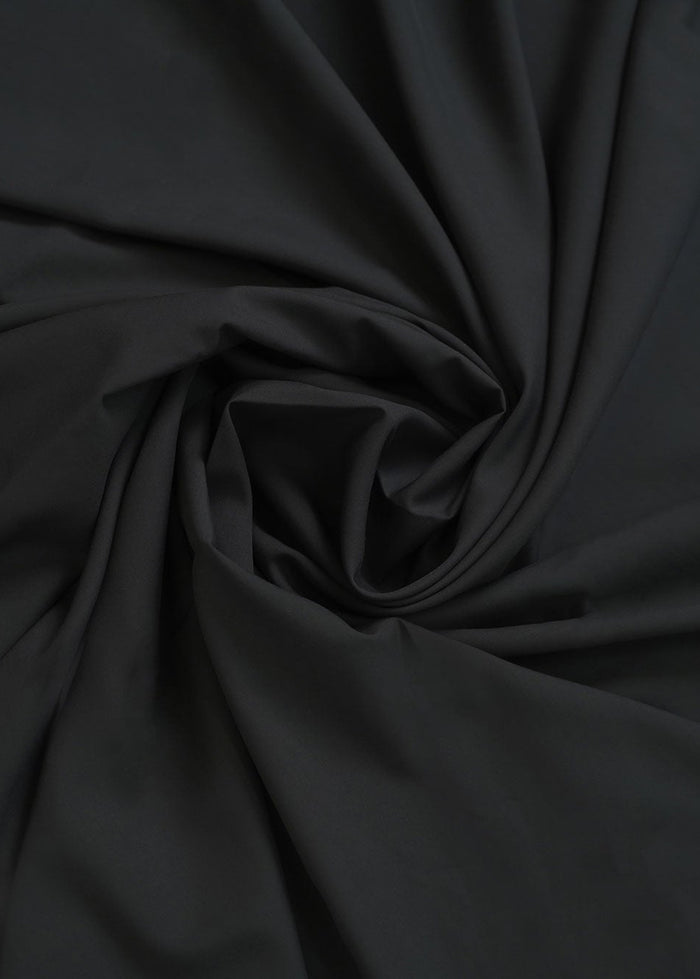 Black dobby fabric with soft, draped texture