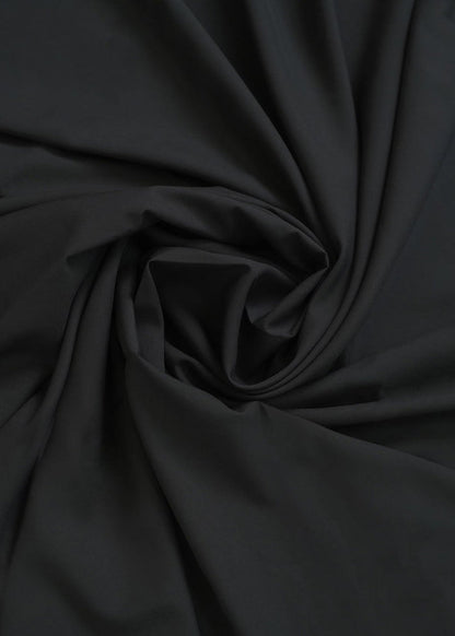 Black dobby fabric with soft, draped texture