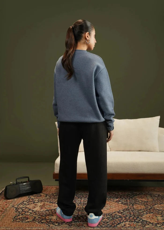 Blue knit crewneck sweatshirt, back view, long sleeves with ribbed cuffs