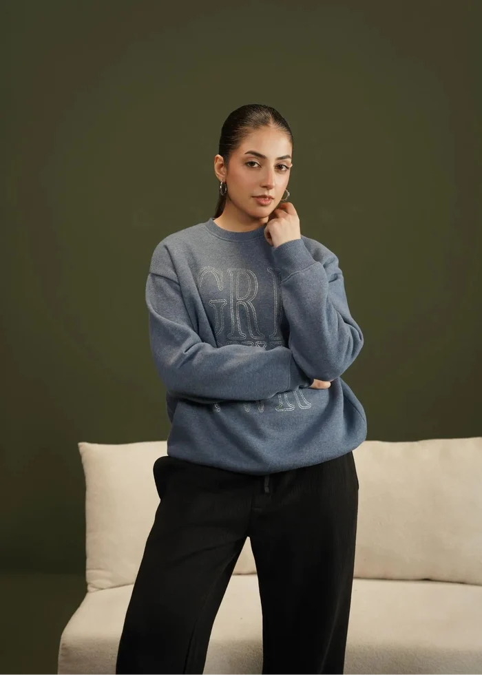 Blue crewneck knit sweatshirt with large 'GRL' logo, long sleeves and relaxed fit