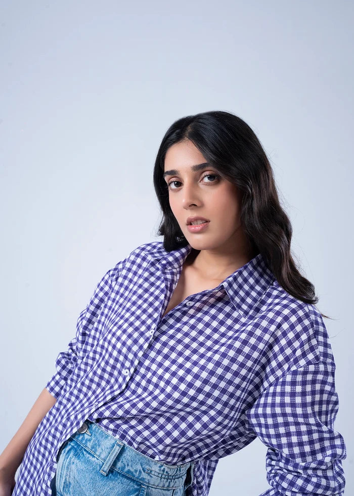 Women’s purple-and-white check top, long sleeves and collared button-up neckline close-up