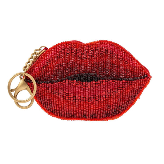 Red beaded lip-shaped coin purse key chain with a gold clasp on a white background